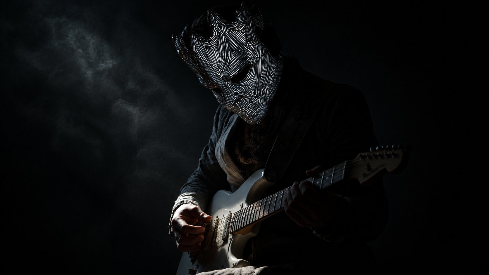 Muzyk w masce z gitarą — tożsamość pozostaje częścią tajemnicy